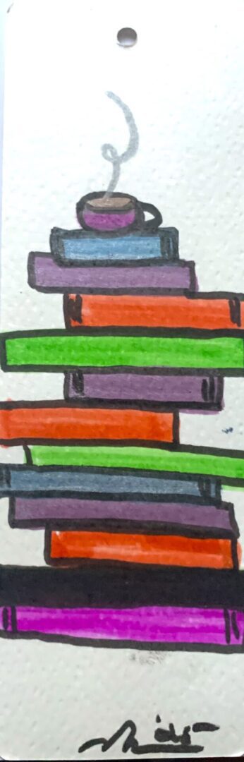 Stack of colorful books with coffee cup