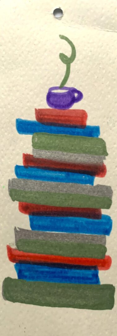 Stack of colorful books topped by steaming teacup