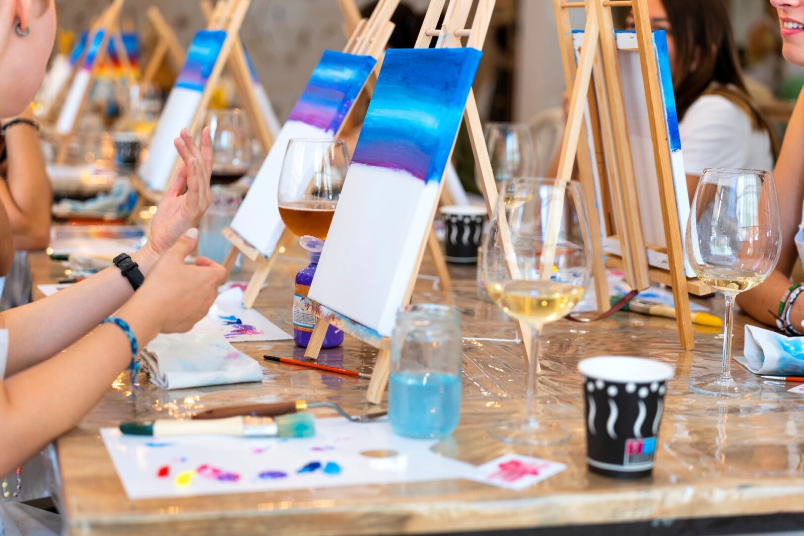 Paint and sip night with blue canvases